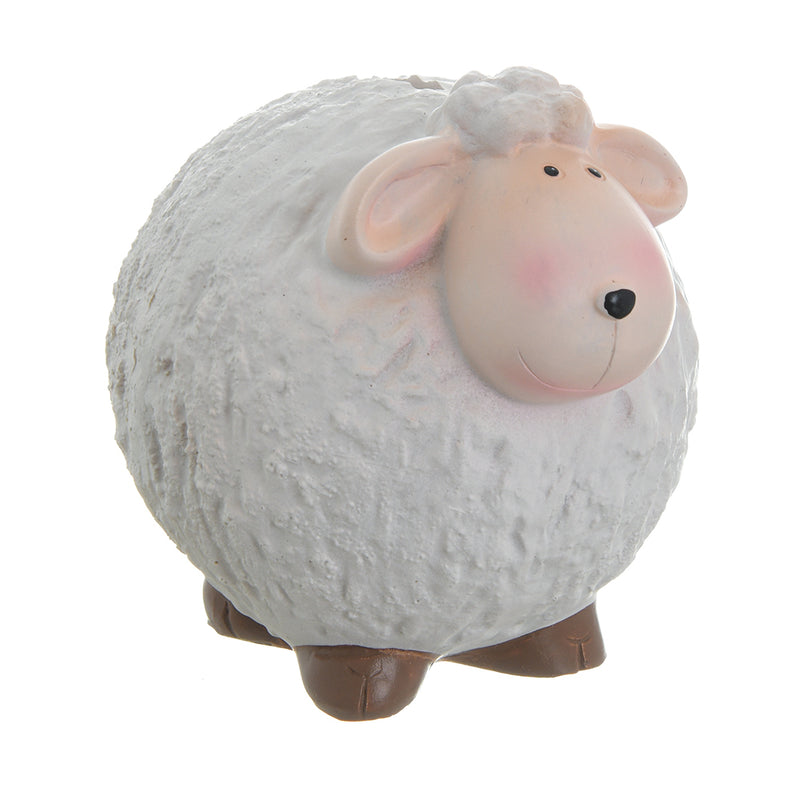 A piggy bank in the shape of a white sheep