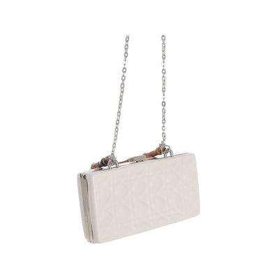 A rectangular women's bag with a wooden handle on the top and a white silver chain