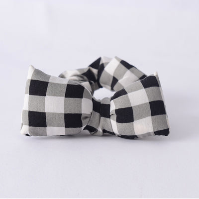 Women's fabric elastic band in the shape of a gray caro bow