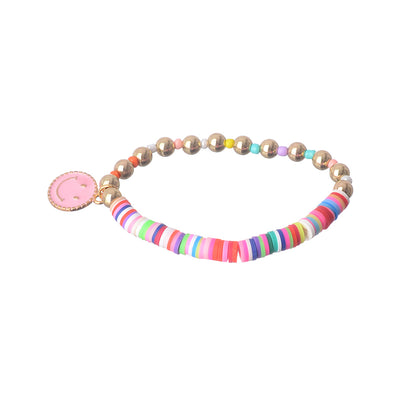 An elastic wrist bracelet made of multi-colored beads and rubber with a smile pendant