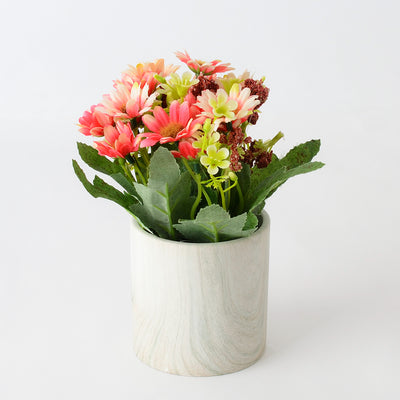 Ceramic vase with artificial flowers