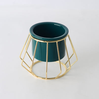 Decorative ceramic vase with a gold metal stand in a geometric shape