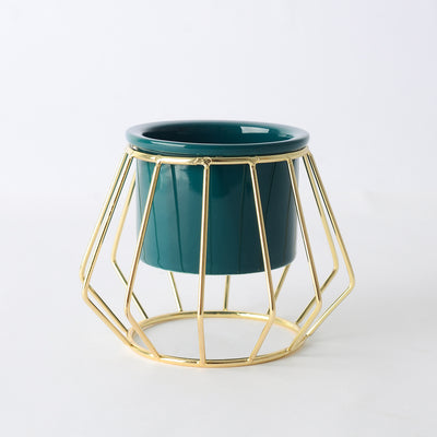 Decorative ceramic vase with a gold metal stand in a geometric shape