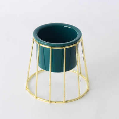 Decorative ceramic vase with a gold metal stand in a geometric shape