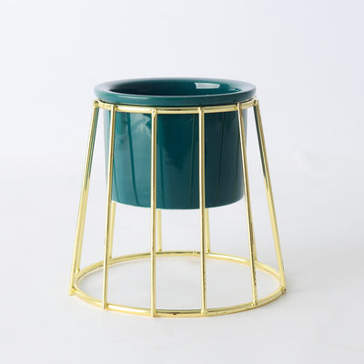 Decorative ceramic vase with a gold metal stand in a geometric shape