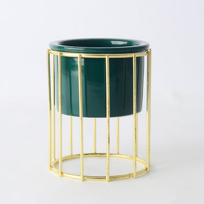 Decorative ceramic vase with a gold metal stand in a geometric shape