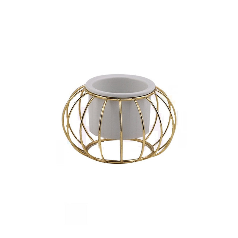 Decorative ceramic vase with a gold metal stand in a geometric shape