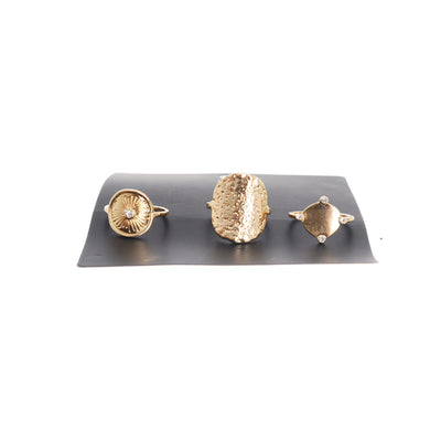 A simple design ring set of different shapes, consisting of 3 pieces, size 17, gold colour