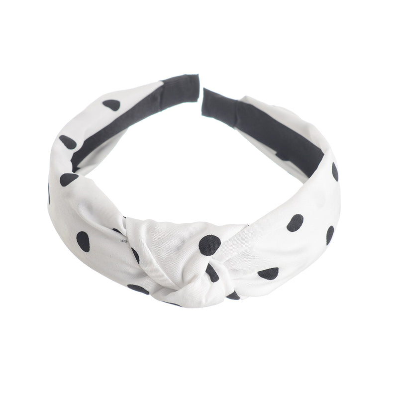 A hairband for women in the shape of a dotted bow