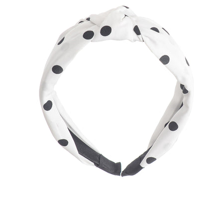 A hairband for women in the shape of a dotted bow