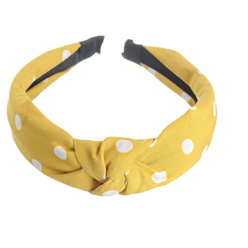 A hairband for women in the shape of a dotted bow