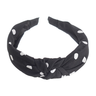 A hairband for women in the shape of a dotted bow