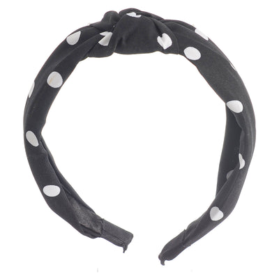 A hairband for women in the shape of a dotted bow