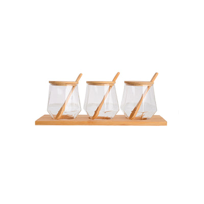 A set of spices in glass jars with a lid and a wooden base in a geometric shape, 3 pieces, transparent, 9 * 6.5 * 3 bottles