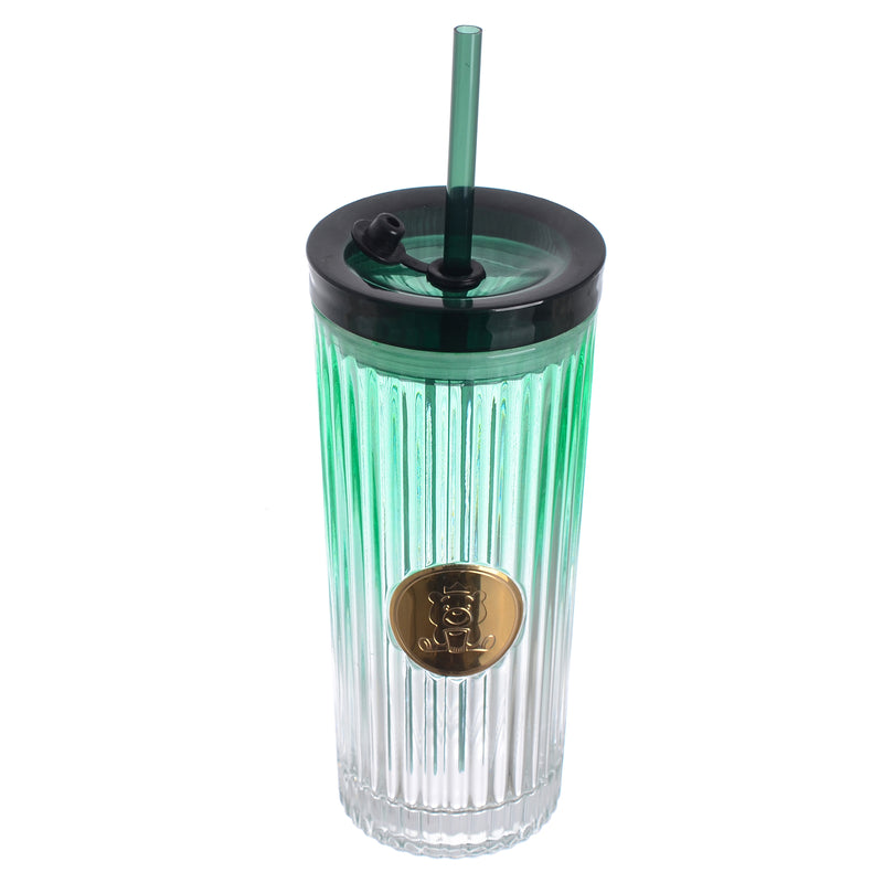 A graduated glass cup with a straw in the shape of a gummy bear with a tight-fitting lid