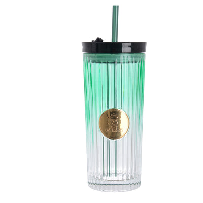 A graduated glass cup with a straw in the shape of a gummy bear with a tight-fitting lid