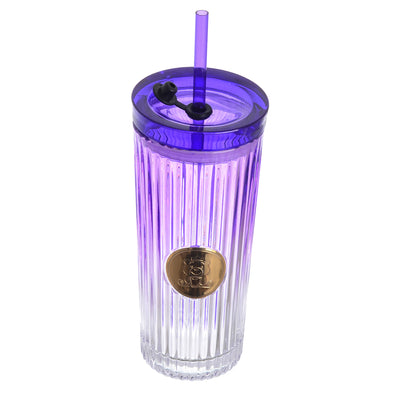 A graduated glass cup with a straw in the shape of a gummy bear with a tight-fitting lid