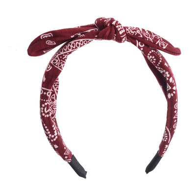 A bow-shaped headband for women, patterned