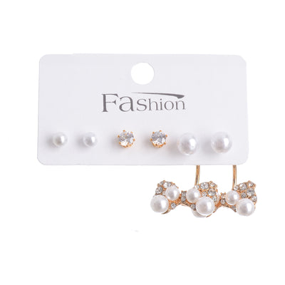 A set of 3 pairs of earrings with a bow stud