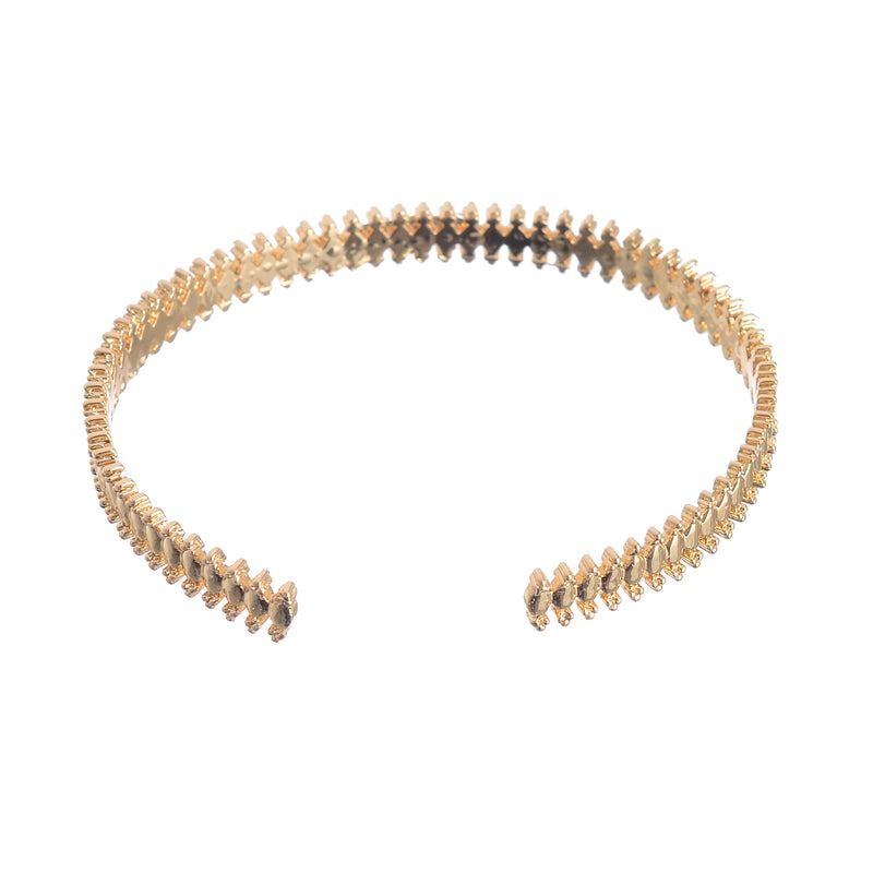 A distinctive and modern open hand bracelet in gold colour