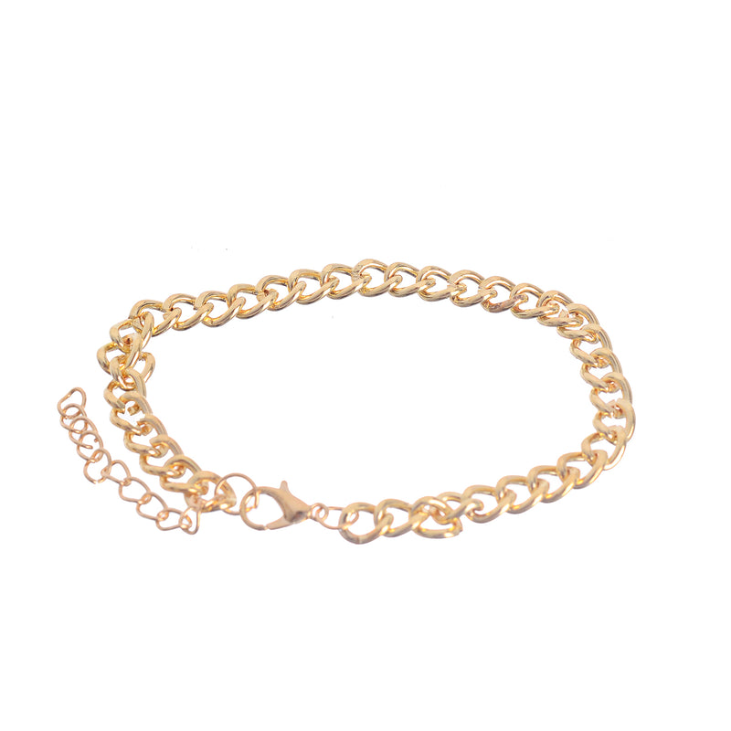 A hand chain with 3 separate layers, an oval ring-shaped chain with a white gold bead