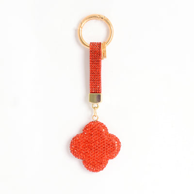 ميدالية و سلسلة مفاتيح ودلايه شنطة يد على شكل زهرة رباعية بأحجار الراين