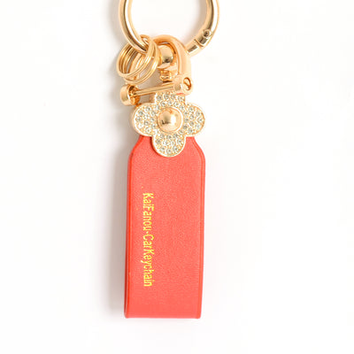 ميدالية و سلسلة مفاتيح ودلايه شنطة يد على شكل زهرة مرصعة بفصوص الزركون