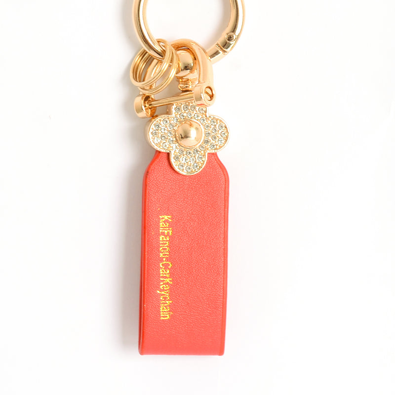 ميدالية و سلسلة مفاتيح ودلايه شنطة يد على شكل زهرة مرصعة بفصوص الزركون