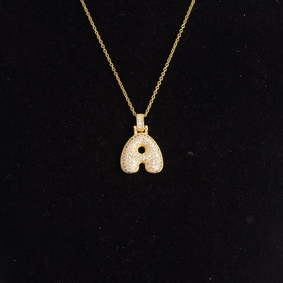 سلسلة رفيعة بدلاية أشكال حروف مرصع بفصوص الزركون ملونة باللون الذهبي