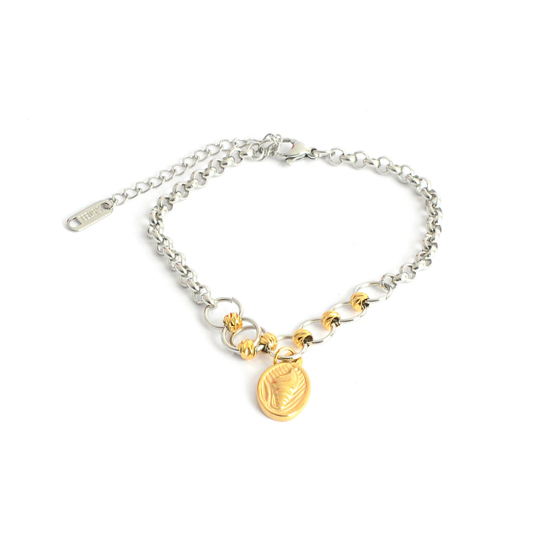 انسيال بلون ذهبي وفضي بتصميم حلقات دائرية متصلة بدلاية بيضاوية