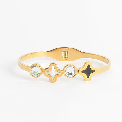 سوار يد صلب تصميم  بزخرفة زهرة رباعية وفصين زركون لون ذهبي