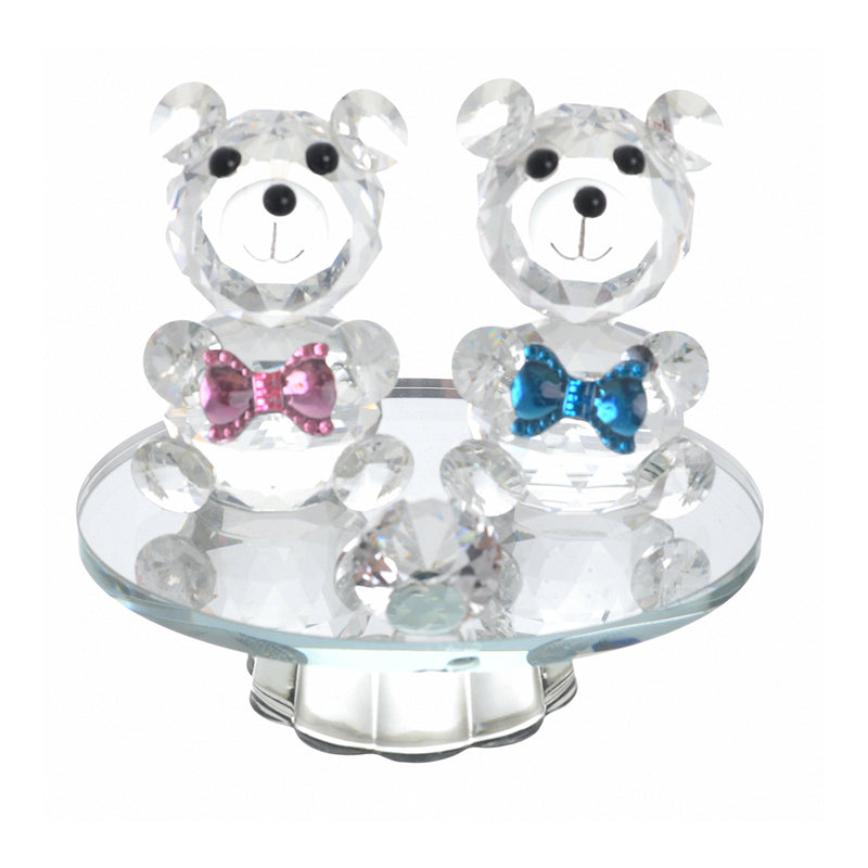 Crystal in the shape of two transparent teddy bears