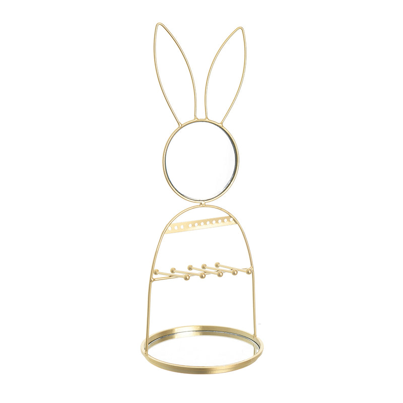 A golden metal standing mirror in the shape of a rabbit