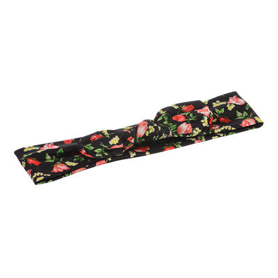 A bow hair headband with small rose patterns