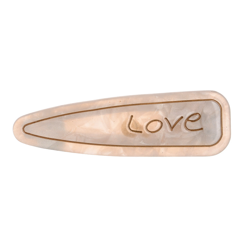 Hair clip with the word “Love” design