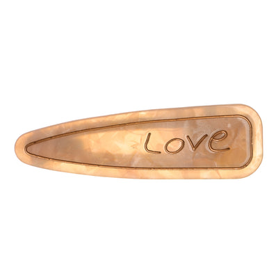 Hair clip with the word “Love” design