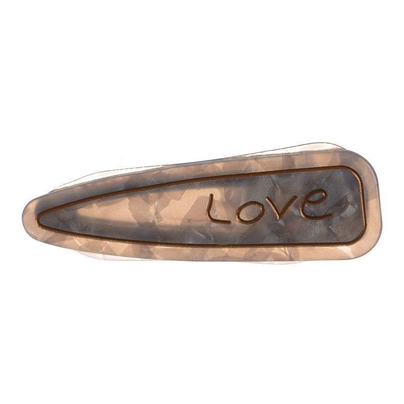 Hair clip with the word “Love” design