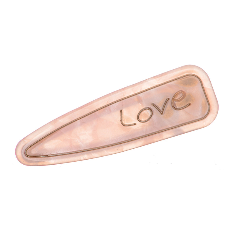 Hair clip with the word “Love” design