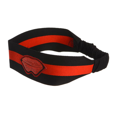 A hair band with a red stripe