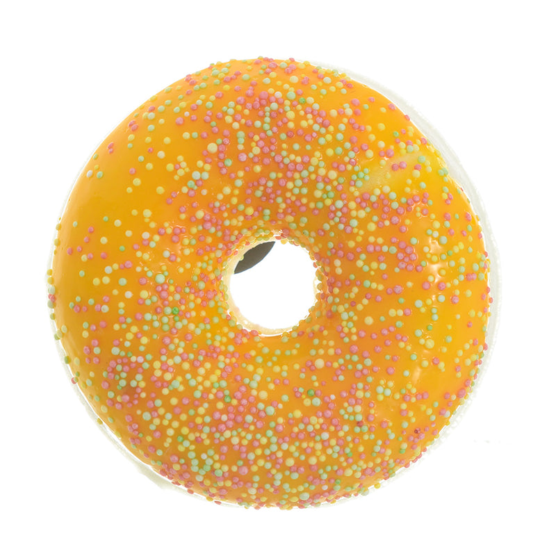 Small yellow donuts with magnets attached to the refrigerator