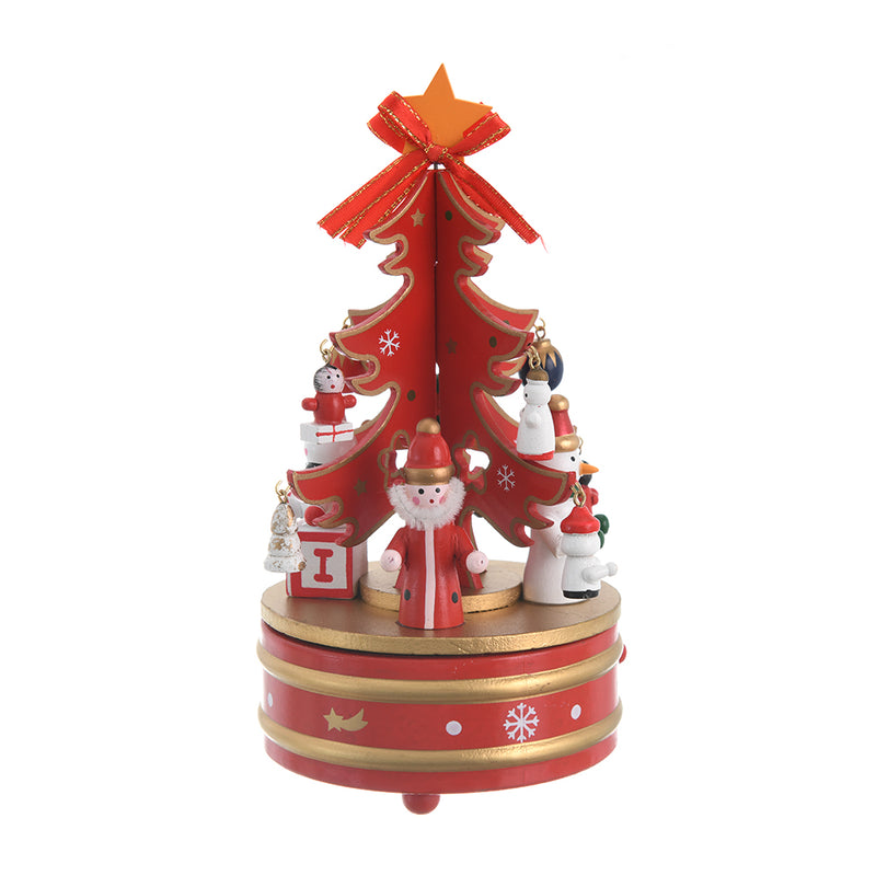 A Christmas music box with a wooden revolving design and a red, gold, and white spring