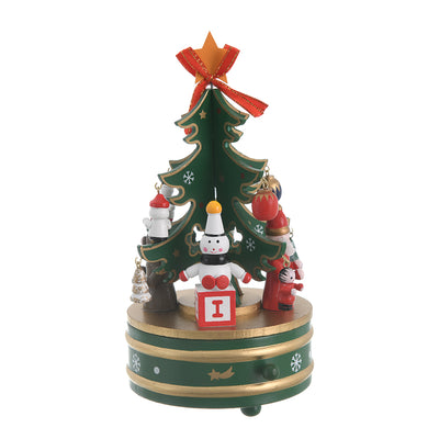 A Christmas music box with a wooden revolving design and a green*golden*white spring