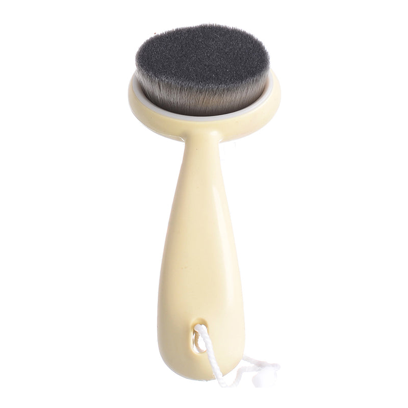 Beige facial cleansing brush 