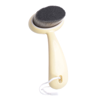 Beige facial cleansing brush 