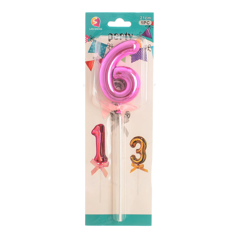 A stick decorates the cake and celebrates the number 6, the color fuchsia