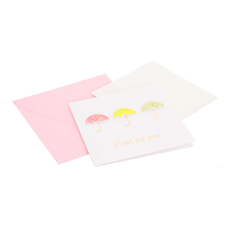 A square greeting card with a pink umbrella-shaped envelope