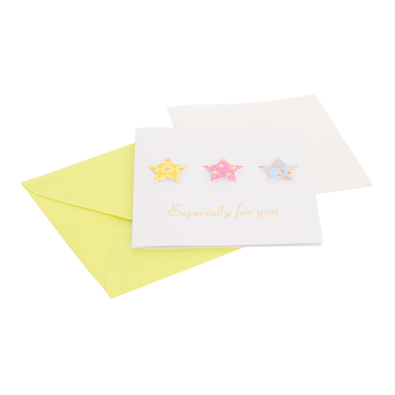 A square greeting card with a green star-shaped envelope