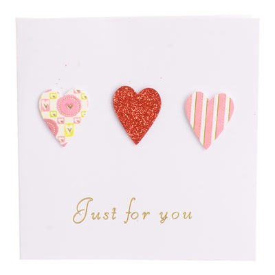 A square greeting card with a pink heart-shaped envelope