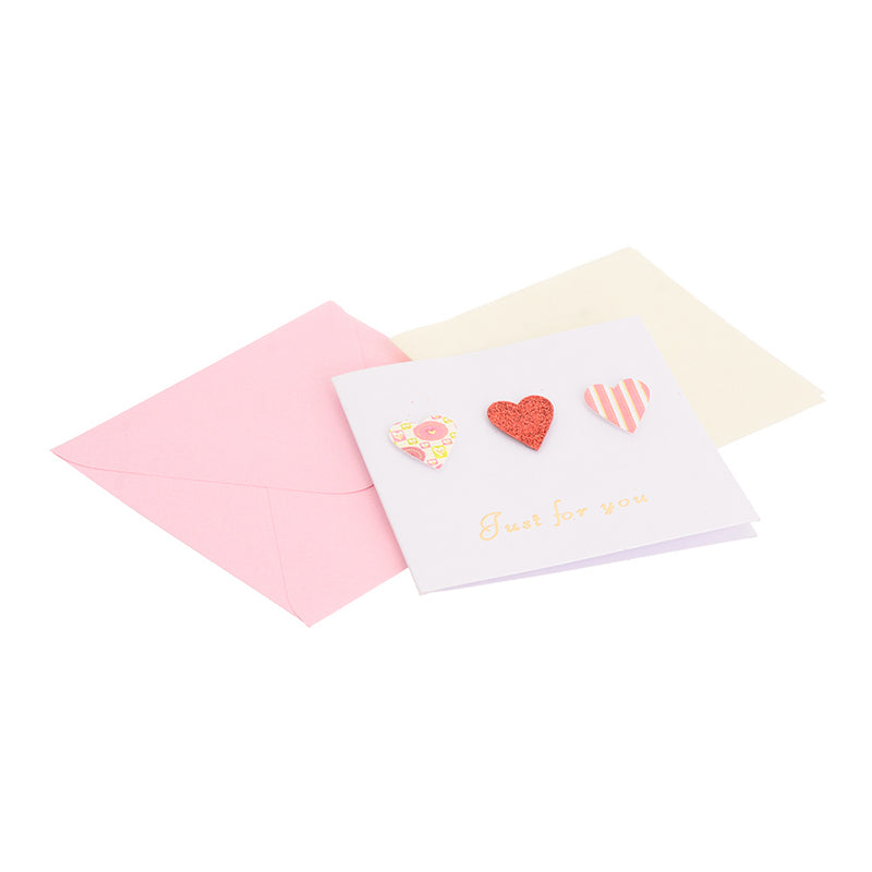 A square greeting card with a pink heart-shaped envelope