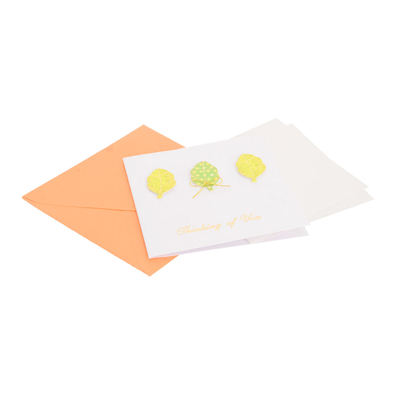 A square greeting card with an orange leaf-shaped envelope